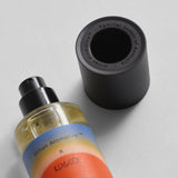 Soul Nectar parfum bottle beside its black cap engraved with Mihan Aromatics, Familial Scents of Australia
