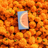 Mihan Aromatics x Kip&Co Soul Nectar box laid on a bed of orange marigolds