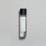 Mikado Bark Parfum bottle on a gray background, evoking autumn's calm with crisp air and soft sunlight.