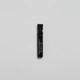 Munlark Ash Parfum by Mihan Aromatics in a sleek black spray vial against a plain backdrop.