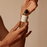 Munlark Ash Parfum by Mihan Aromatics in hand, showcasing a blend of earthy and smoky scents.