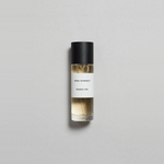 Munlark Ash Parfum by Mihan Aromatics in a sleek glass bottle on a soft gray background.