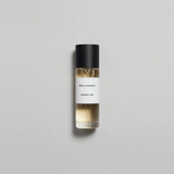 Munlark Ash Parfum by Mihan Aromatics in a sleek glass bottle on a soft gray background.