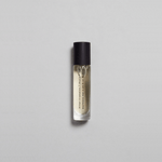 Munlark Ash Parfum by Mihan Aromatics in a sleek glass roller bottle, evoking nature's calm essence.
