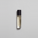 Munlark Ash Parfum by Mihan Aromatics in a sleek glass roller bottle, evoking nature's calm essence.
