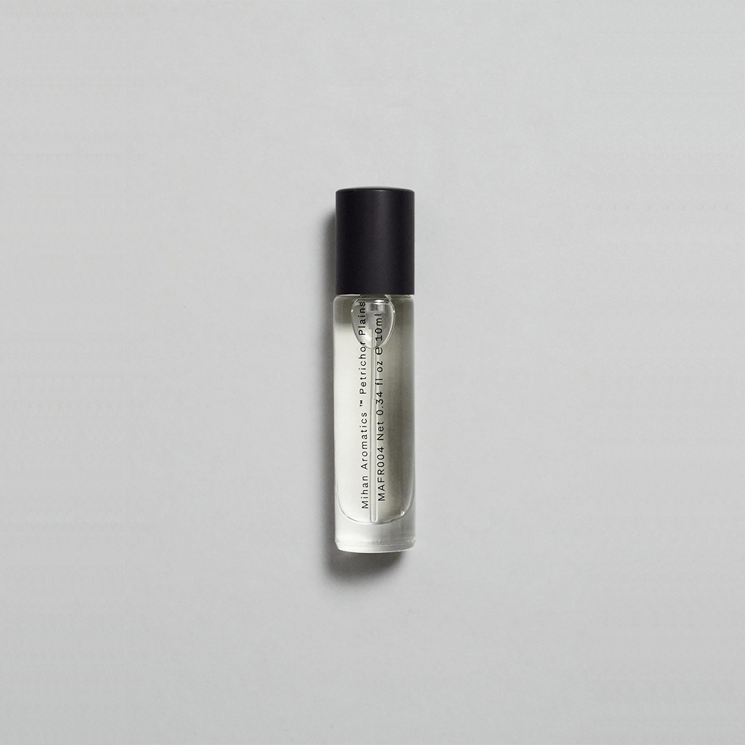 Petrichor Plains Parfum by Mihan Aromatics, capturing the essence of rain on dry earth in a sleek roller bottle.
