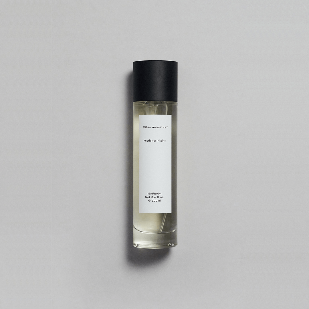 Petrichor Plains Parfum by Mihan Aromatics in a sleek bottle, evoking the essence of rain on dry earth.