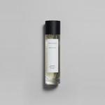 Petrichor Plains Parfum by Mihan Aromatics in a sleek bottle, evoking the essence of rain on dry earth.