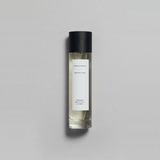 Petrichor Plains Parfum by Mihan Aromatics in a sleek bottle, evoking the essence of rain on dry earth.