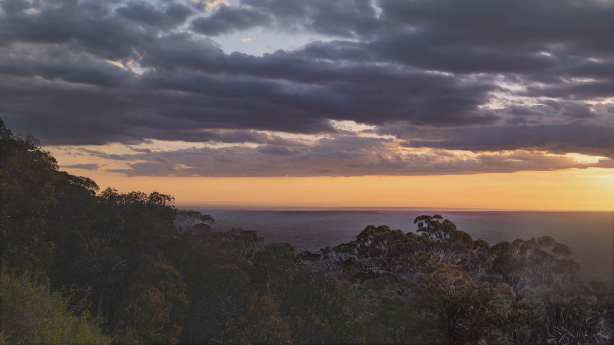 Timelapse of the sun setting over a valley of Australian bushland