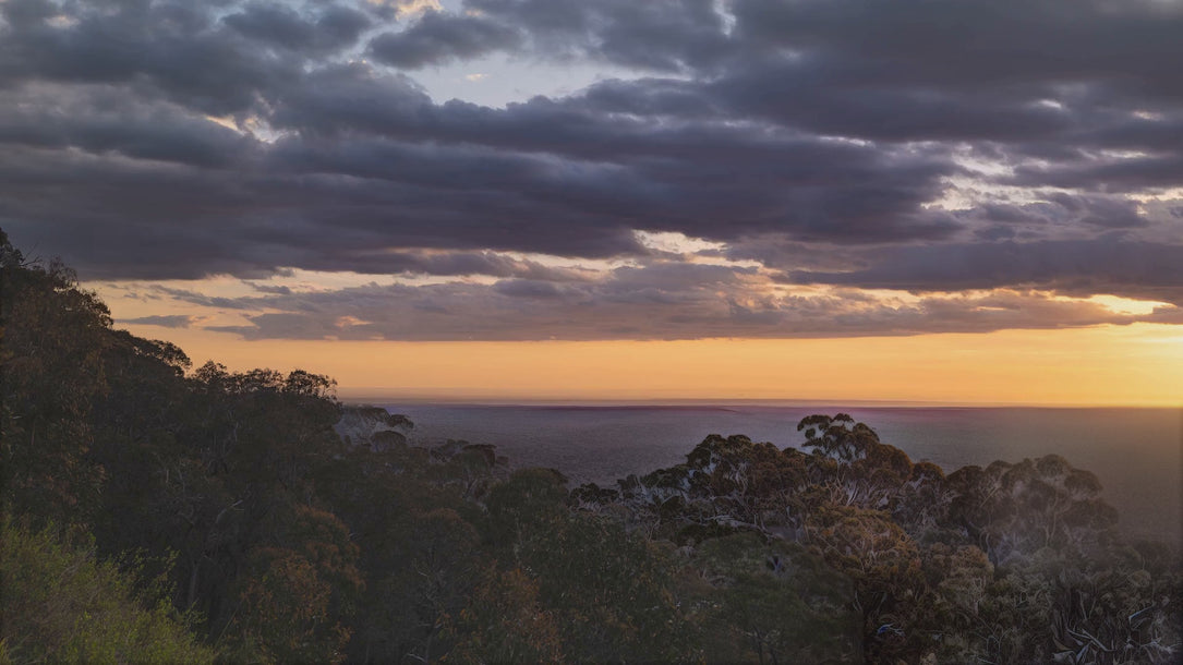 Timelapse of the sun setting over a valley of Australian bushland