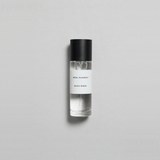 Sienna Brume Parfum bottle on a light background, evoking summer vibes with coconut and cucumber notes.