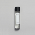 Sienna Brume Parfum bottle featuring a minimalist design with a black cap and crisp fragrance.