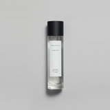 Sienna Brume Parfum bottle featuring a minimalist design with a black cap and crisp fragrance.