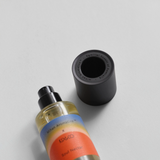 Soul Nectar Parfum by Mihan Aromatics and Kip&Co, showcasing the vibrant bottle and cap on a minimalist background.